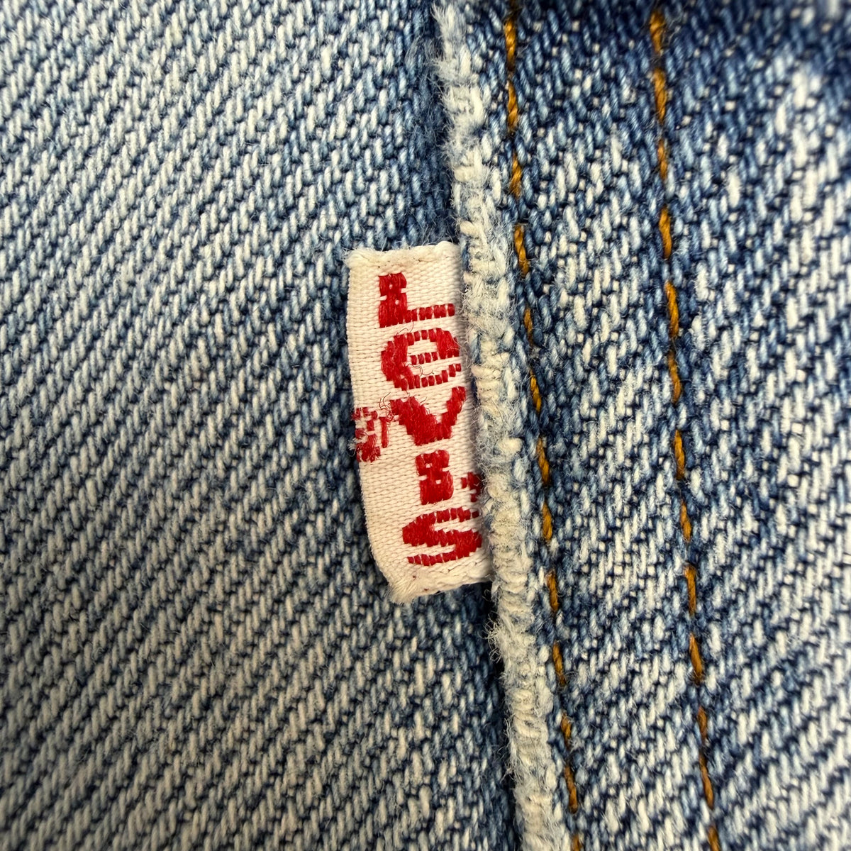 Vintage Levi’s Distressed Light Wash Flared White Tab Jeans