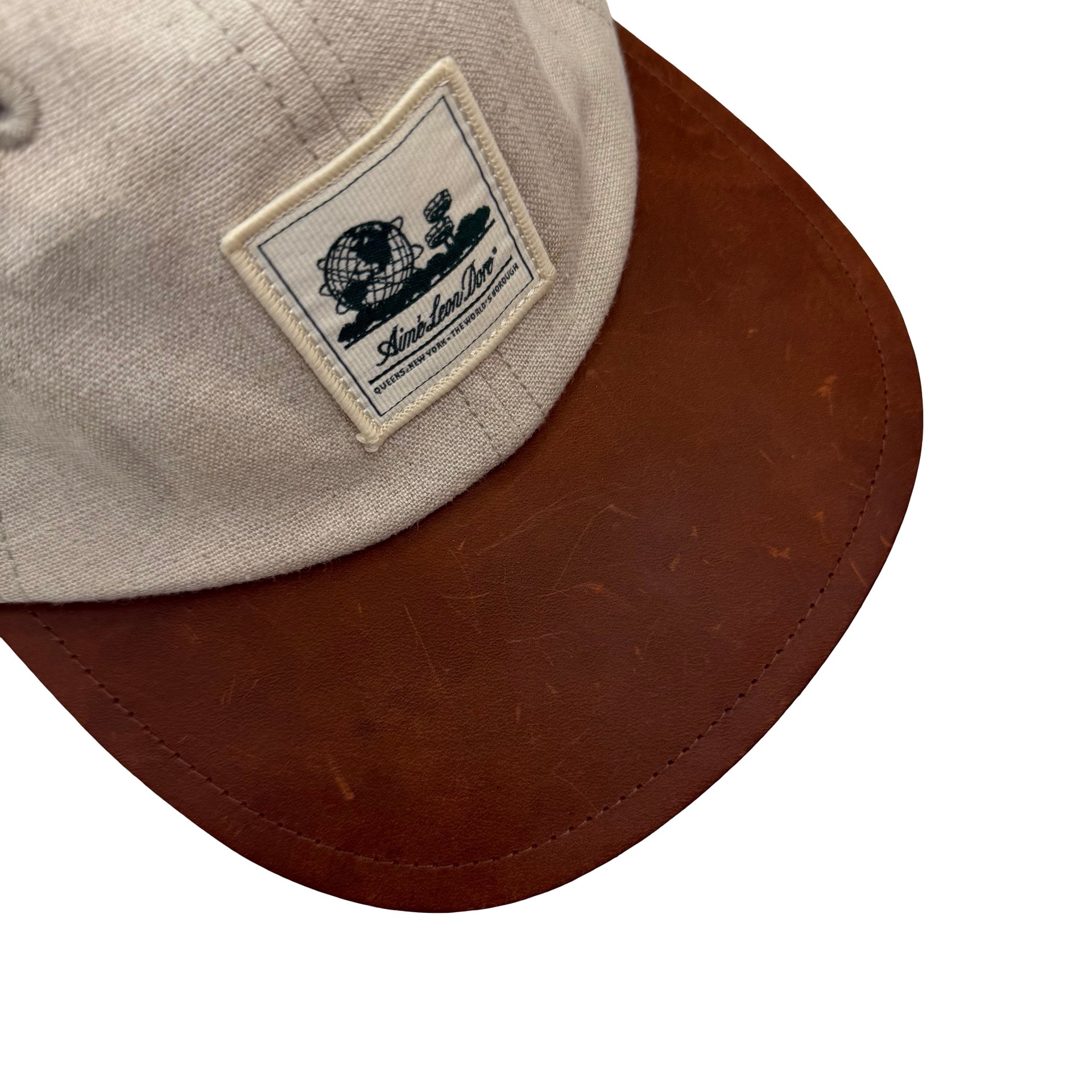 Aimé Leon Dore Unisphere Leather Brim Hat Beige