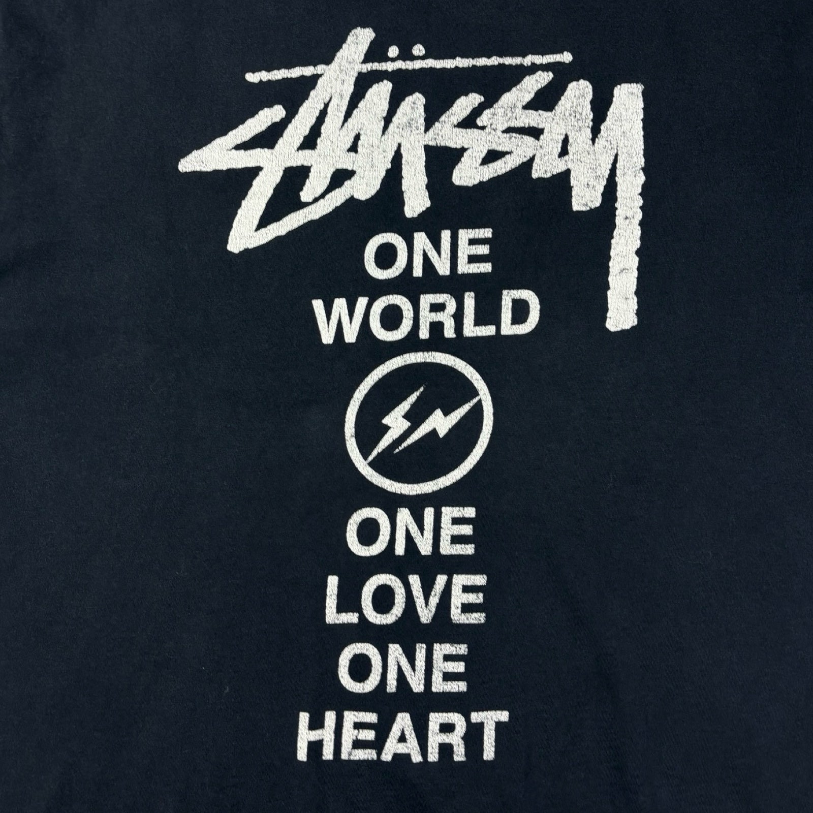 Stussy x Fragment “One World One Love One Heart” Tee Black