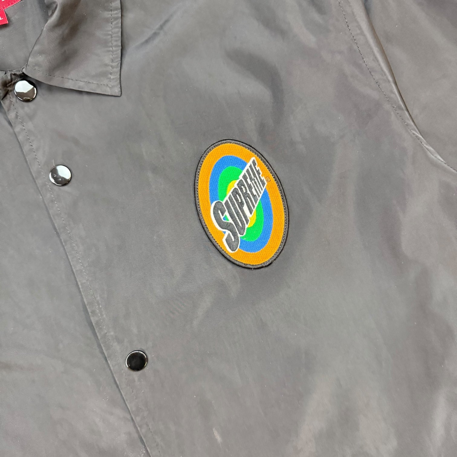 Supreme Spin Logo Coach Jacket Black