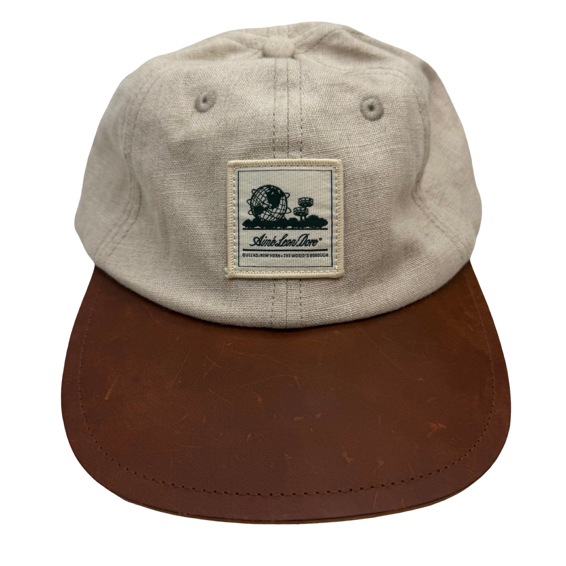 Aimé Leon Dore Unisphere Leather Brim Hat Beige