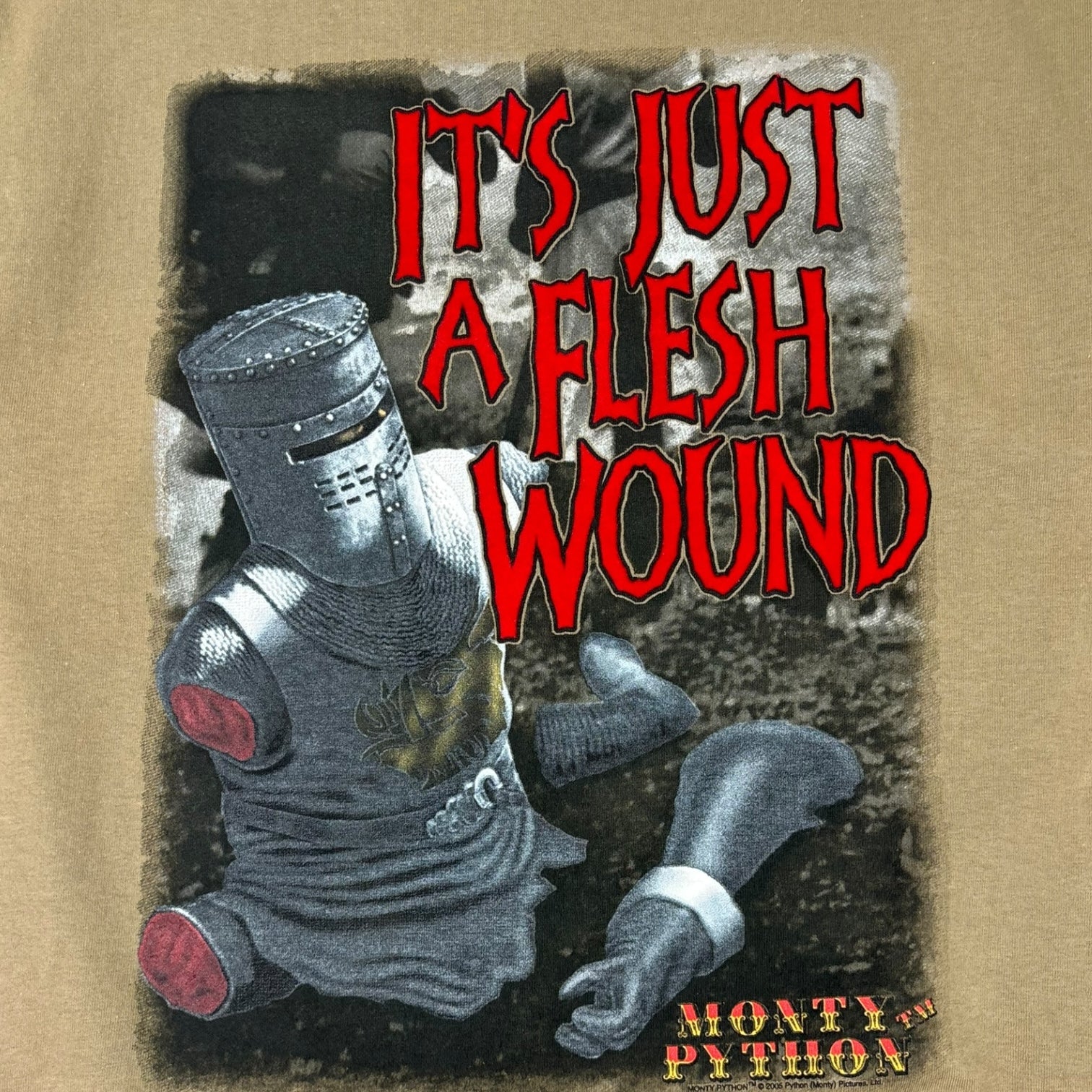 Vintage 2005 Monty Python “It’s Just A Flesh Wound” T-Shirt Tan
