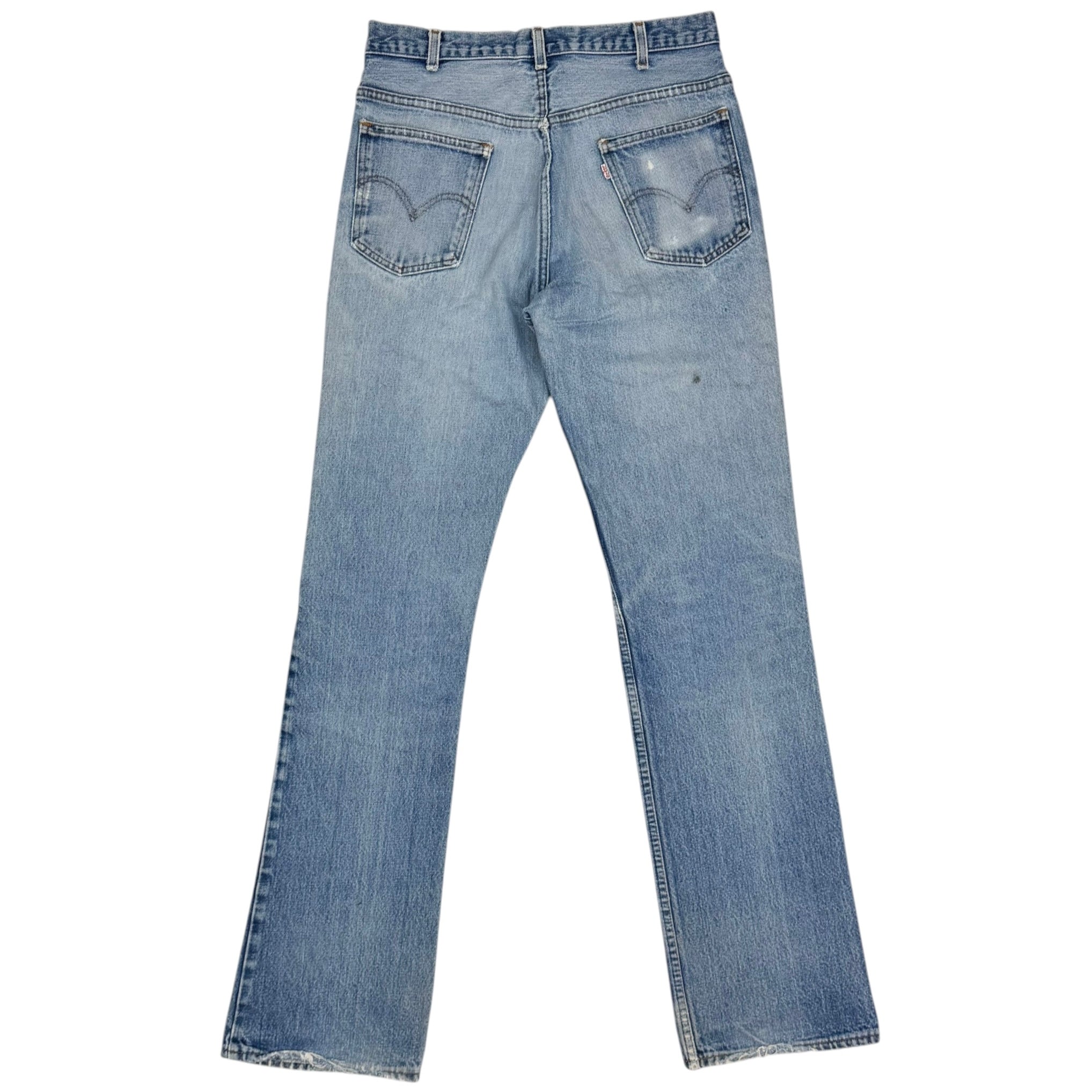 Vintage Levi’s Distressed Light Wash Flared White Tab Jeans