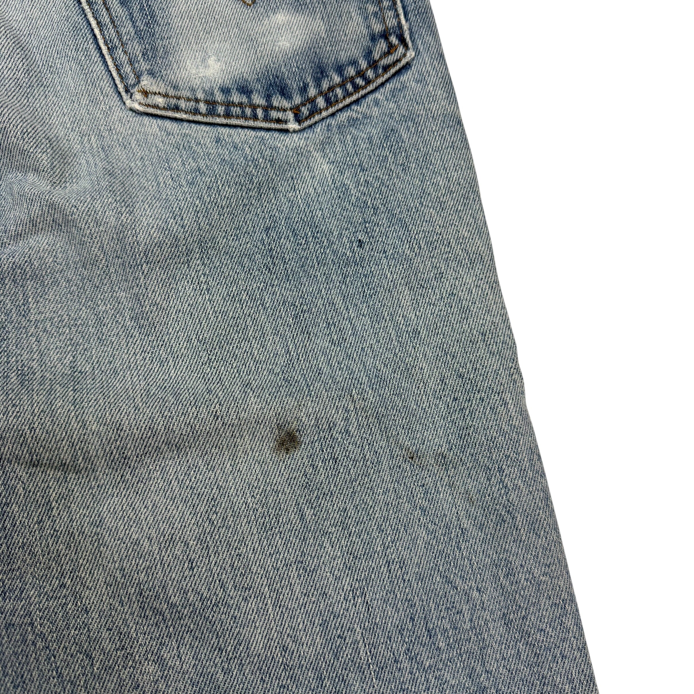 Vintage Levi’s Distressed Light Wash Flared White Tab Jeans