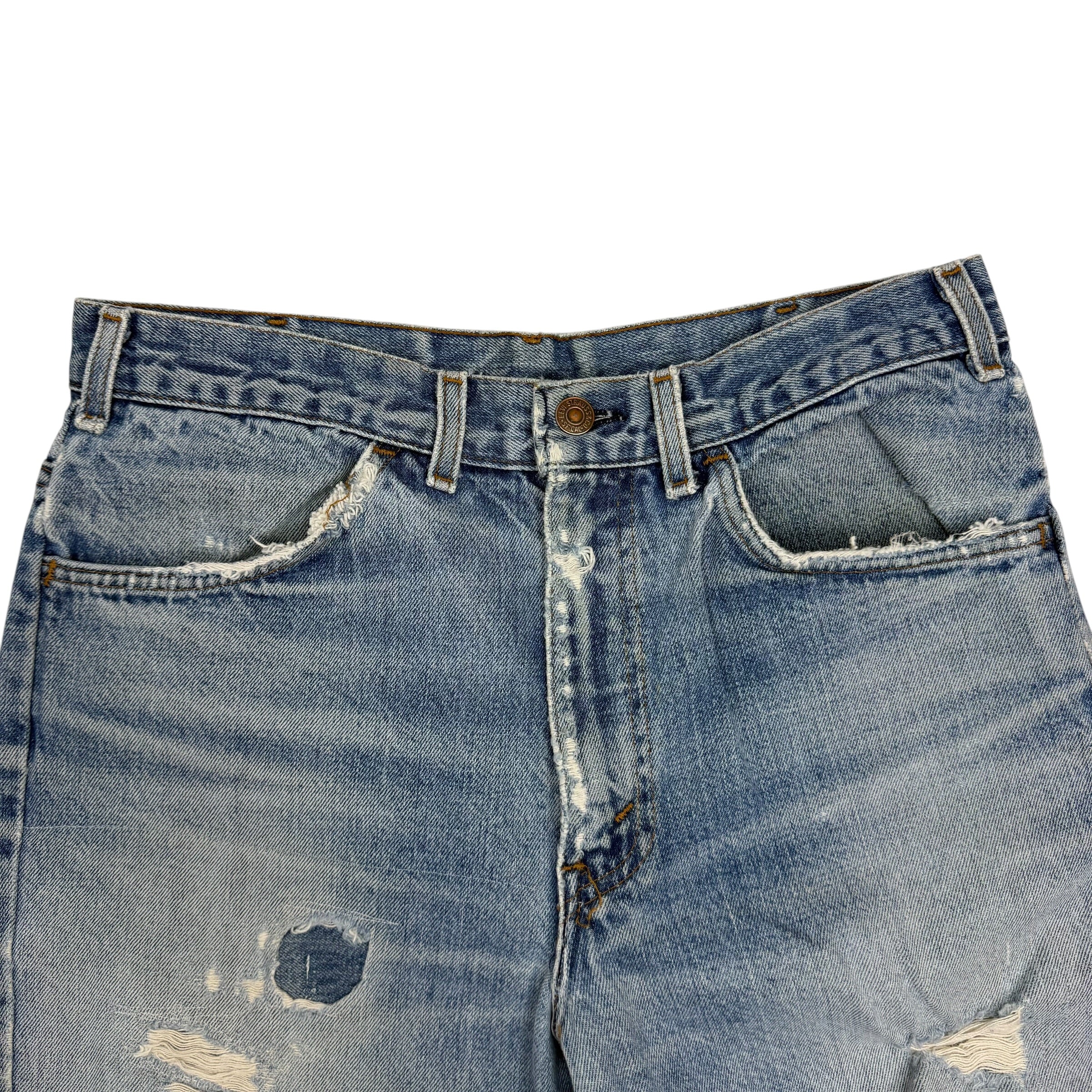 Vintage Levi’s Distressed Light Wash Flared White Tab Jeans