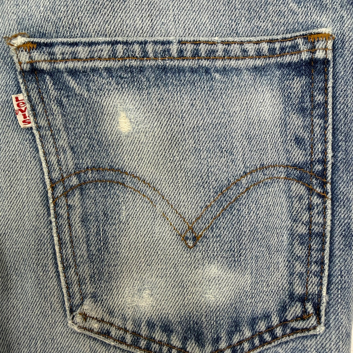 Vintage Levi’s Distressed Light Wash Flared White Tab Jeans