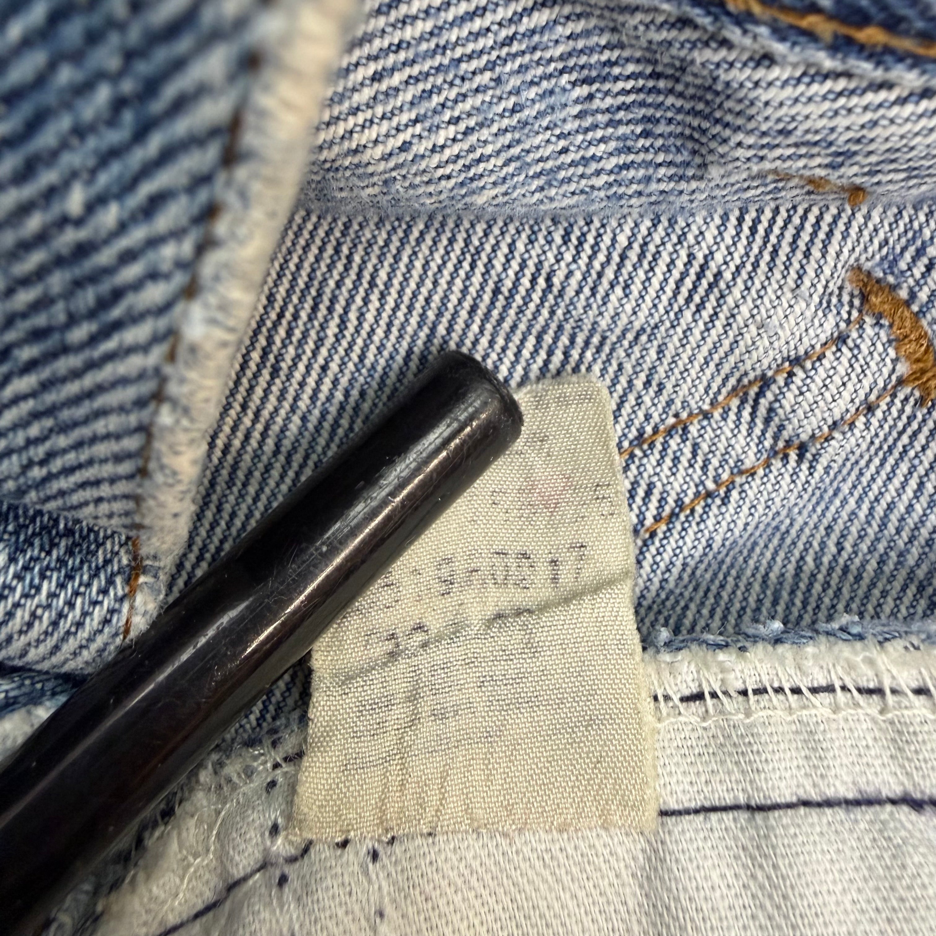 Vintage Levi’s Distressed Light Wash Flared White Tab Jeans